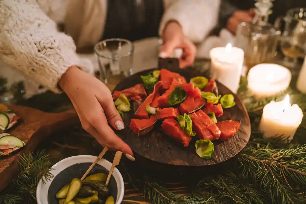 Sliced smoked salmon on a wooden board